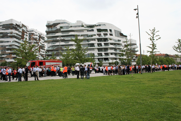 Milan - Italy - June 11, 2019. People gathering during an evacuation drill in Milan City Life district.